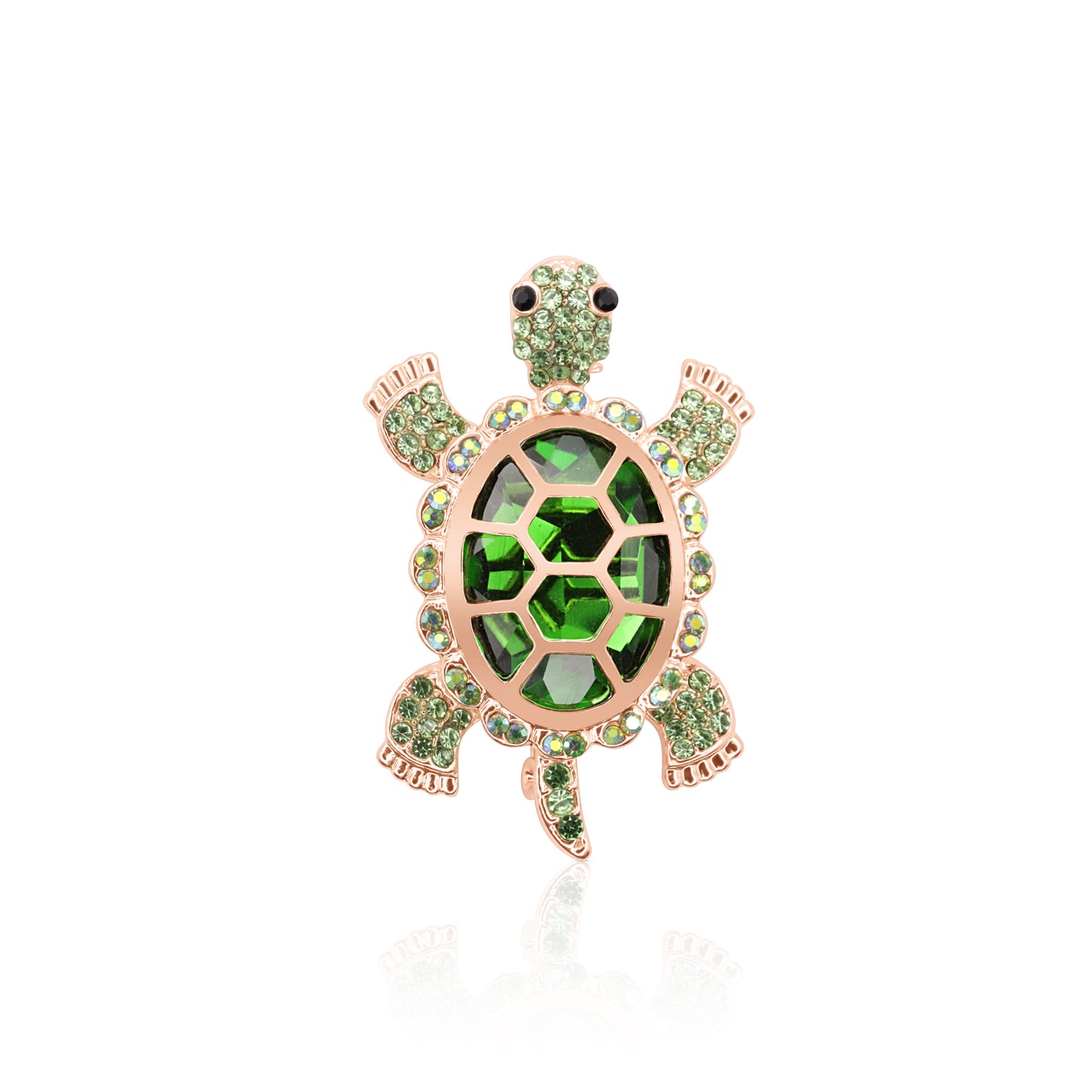 A striking turtle-shaped brooch adorned with vibrant green crystals and set on a gold-tone base, featuring a secure pin clasp and lifelike detailing.