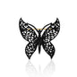 A striking black lace butterfly brooch crafted from matte black alloy, featuring intricate cut-out designs that evoke a delicate lace effect. The wings showcase a captivating texture, while the secure pin-back closure ensures easy attachment to clothing, bags, or scarves. Perfect for adding a touch of gothic allure to any outfit.