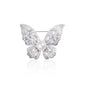 Close-up image of the Celestia Radiance Butterfly Brooch featuring intricately designed wings encrusted with brilliant white crystals and a central pearl bead. The brooch gleams in a rhodium-plated finish, styled in a butterfly shape symbolizing grace and renewal. Perfectly balanced in design and sparkle, it reflects on a white surface to enhance its shimmer, making it a stunning choice for special occasions or elegant everyday styling.