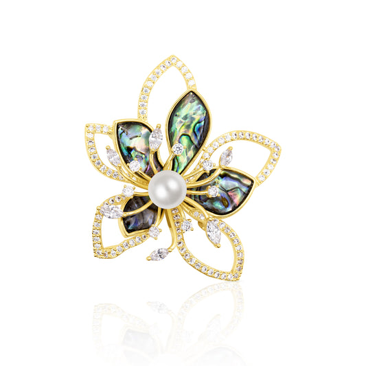 Elegant floral brooch featuring five shimmering abalone shell petals framed in gold with sparkling cubic zirconia accents. Centered with a lustrous faux pearl, this brooch blends natural iridescence with refined sparkle. Perfect statement accessory for weddings, evening wear, or gifting someone who appreciates luxurious botanical designs.