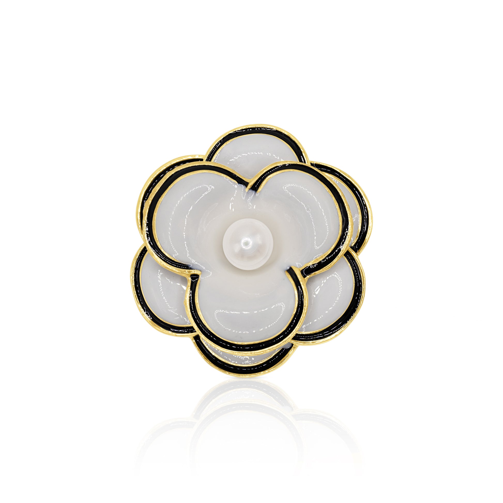 A chic black and white camellia flower brooch with a lustrous faux pearl center. The polished gold-tone base and secure pin closure make it an exquisite accessory for any vintage-inspired look.