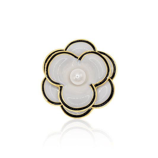 A chic black and white camellia flower brooch with a lustrous faux pearl center. The polished gold-tone base and secure pin closure make it an exquisite accessory for any vintage-inspired look.