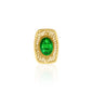 An exquisite filigree brooch featuring a prominent emerald green crystal centerpiece set in an ornate gold-tone base. The intricate design includes delicate filigree patterns surrounding the radiant gemstone, creating a timeless, vintage-inspired accessory perfect for any occasion.
