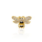 A sparkling golden bee brooch adorned with clear crystals, set against a gold-tone base. The bee features delicate, intricately designed wings, encrusted with glistening stones, and a black enamel body with gold accents. This charming piece is perfect for adding a whimsical yet elegant touch to jackets, scarves, or bags.
