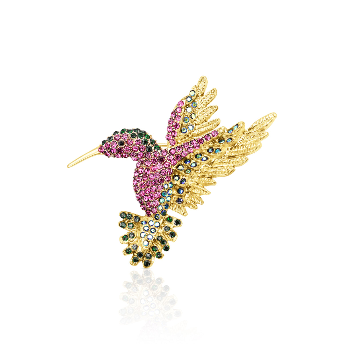 A stunning gold-plated hummingbird-shaped brooch embellished with pink, green, and blue crystals, capturing the elegance of a hummingbird in mid-flight with a secure pin clasp.