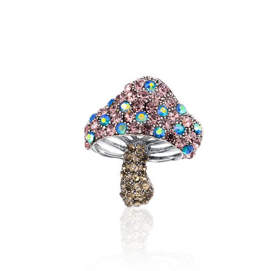 A charming mushroom-shaped brooch adorned with pink, blue, and brown iridescent crystals on a silver-tone base, perfect for adding a playful touch to any look.