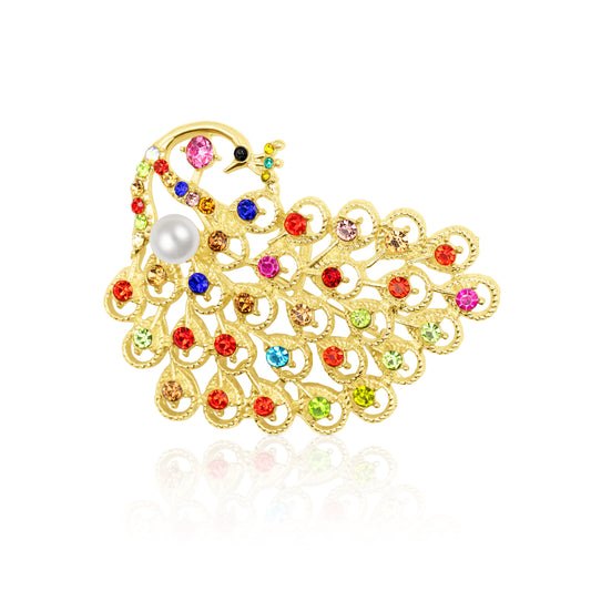 Gold-tone peacock-shaped brooch bursting with vivid multicolor cubic zirconia crystals arranged like a fan-shaped tail. Features a polished faux pearl nestled near the neck and intricate feather cutout detailing. A lively, festive accessory ideal for parties, gifting, or brightening up elegant attire with playful sparkle and regal flair.