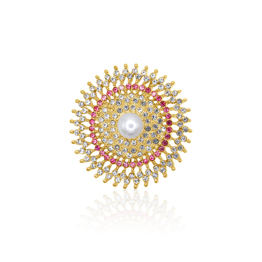 A circular rosette brooch adorned with sparkling pink and clear crystals, centered around a luminous pearl, ideal for formal and casual outfits.