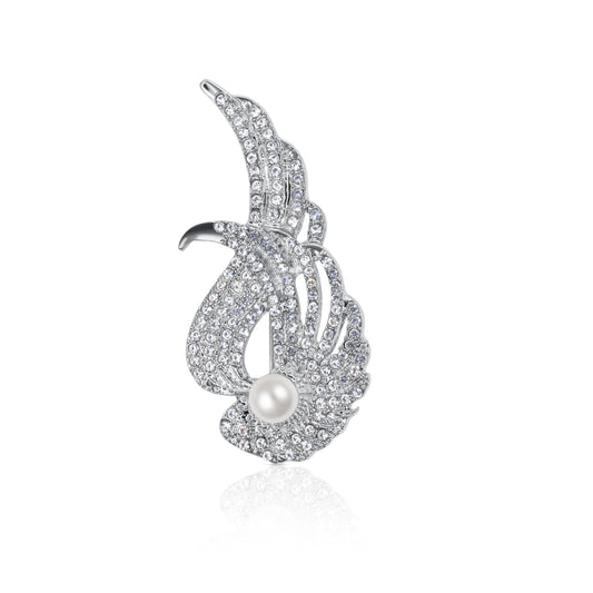 A sparkling silver-tone swan brooch adorned with shimmering crystals and a radiant faux pearl accent. The detailed design and secure pin closure make it an elegant accessory for any formal occasion.