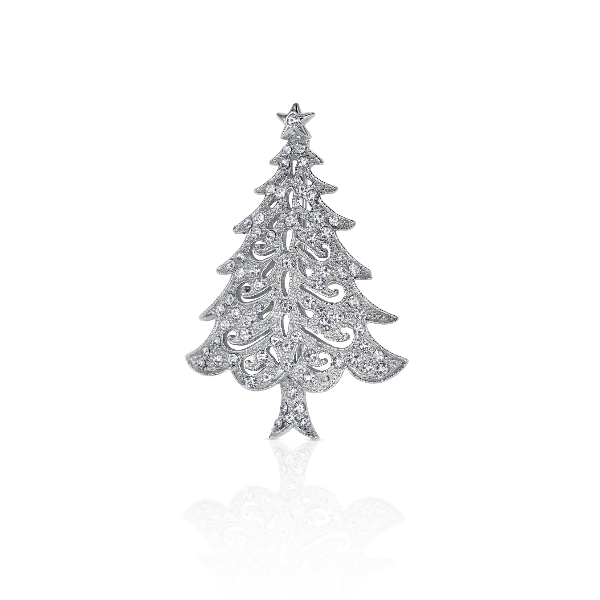 A silver-toned Christmas tree brooch adorned with sparkling crystals, featuring a delicate star at the top, perfect for festive accessorizing.